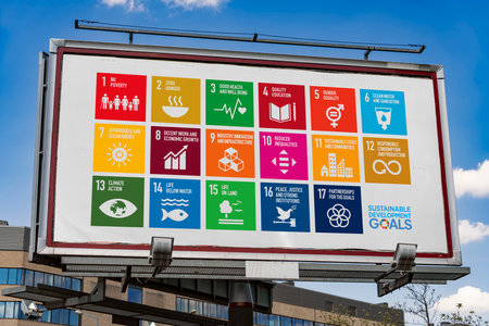 POZNAN, POL - MAY 1, 2022: Advertisement billboard displaying logo of The Sustainable Development Goals, a collection of 17 interlinked global goals set up in 2015 by the United Nations General Assemblyのeditorial素材
