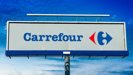 POZNAN, POL - MAY 1, 2022: Advertisement billboard displaying logo of Carrefour, a French multinational corporation specialized in retailのeditorial素材