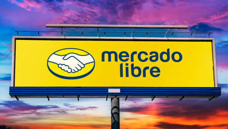 POZNAN, POL - MAY 1, 2022: Advertisement billboard displaying logo of Mercado Libre, an Argentine company that operates online marketplaces dedicated to e-commerce and online auctionsのeditorial素材