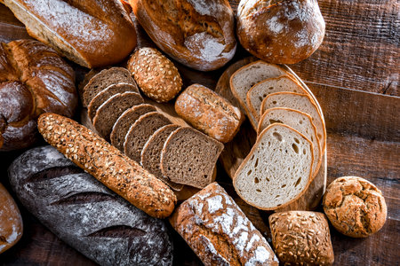 Assorted bakery products including loafs of bread and rolls