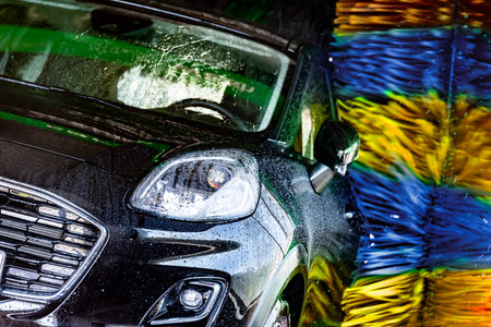 A motorcar in an automatic car wash.の写真素材