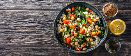 A plate of couscous served with vegetables and chickpeasの写真素材