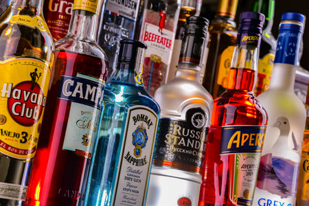 POZNAN, POL - NOV 29, 2023: Bottles of assorted global hard liquor brands in a barのeditorial素材