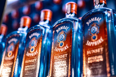 DUBAI, UAE - MAR 22, 2022: Bottles of Bombay Sapphire Sunset special edition gin on a store shelf