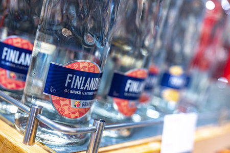 DUBAI, UAE - MAR 22, 2022: Bottles of Finlandia Grapefruit vodka on a store shelf