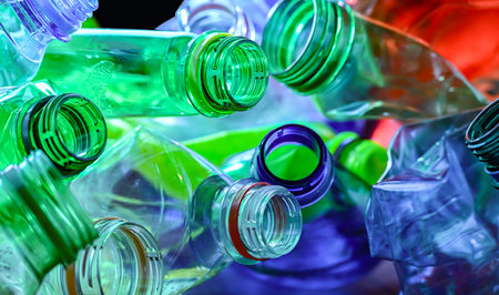 Empty colored drink bottles. Recyclable plastic waste.