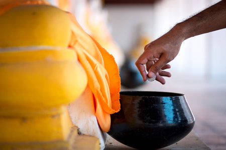 Buddhist donate money for Buddhaの写真素材