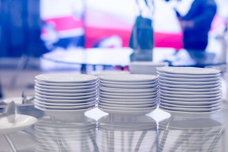 Group of white plates stacked together.の写真素材