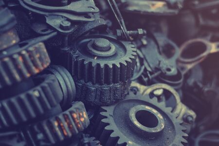 Old Machine parts in warehouses. Car parts in old warehouses. Used vehicle part for recycling in the scrap yard garage. Recycle goodsの写真素材