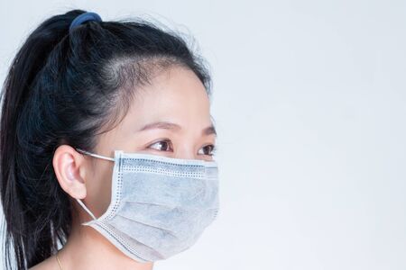 Woman wearing mass to protect corona virus. It is known as informal at the beginning of the outbreak of this diseaseの写真素材