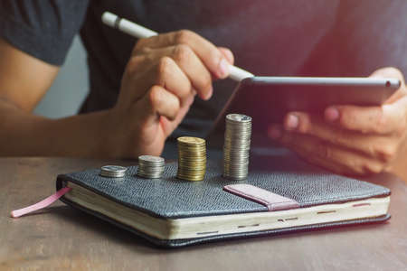 Blurred background business people planning to save moneyの写真素材