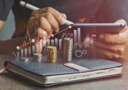 Business man typing stock chart tablet Stock trading technology ideas