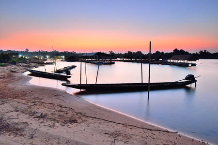 Sunset silhouette longtail boat Thailandの写真素材