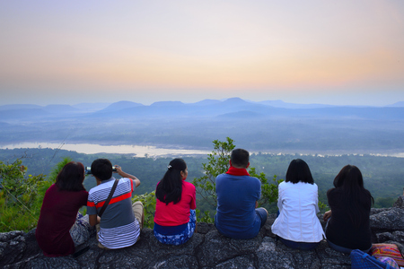 Tourists watching the sun rise on the Pa Tam National Park in the Ubon Ratchathani province , Thailandの写真素材