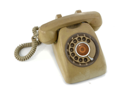vintage retro dial telephone on isolated white backgroundの写真素材