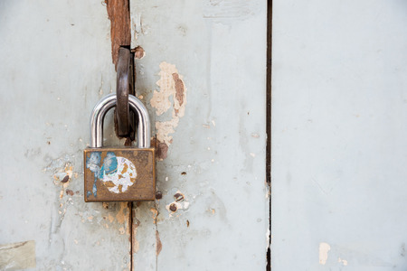 The old padlock on wooden vintage style door.の写真素材