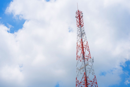 Telecommunications tower with cloud blue sky