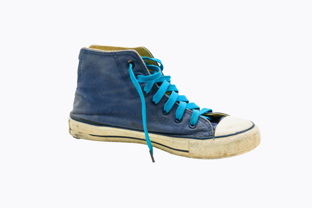 Old Blue sneaker shoes isolated on white background.の写真素材