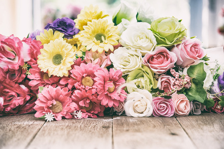 flowers on wooden background.Toned image.