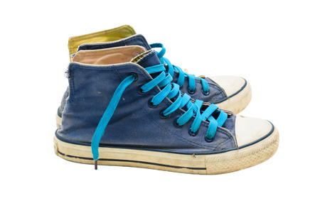 Old Blue sneaker shoes isolated on white background.の写真素材