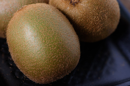 Fresh organic Kiwi fruit on wood background.の写真素材