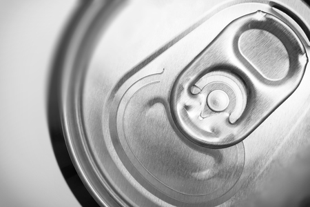 Close up on aluminum ring on soda can used for open can or pop can.