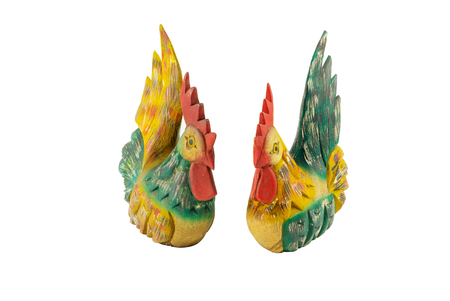 Carved wood sculpture of couple bantam chickens vintage style isolated on white backgroundの写真素材