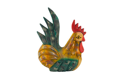 Carved wood sculpture of a bantam chicken isolated on white backgroundの写真素材