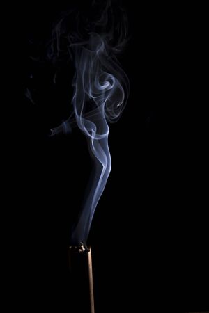 The movement of smoke resembles a woman on a black background. Abstract smoke background on a black background.の写真素材