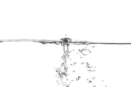  Water waves caused by pouring water into Causing the water waves splashing in the clear white waterの写真素材