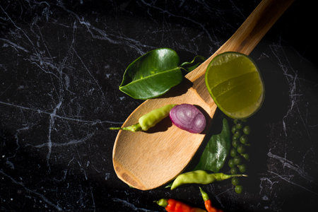 Herbs and spices In the form of Thai food On a black stone slabの写真素材