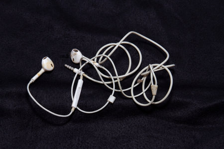 Earphones that have been used before There is a lot of dirt on the black cloth.の写真素材