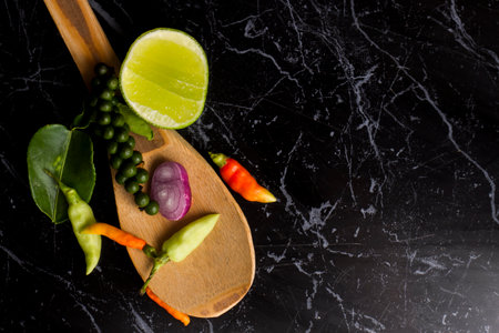 Herbs and spices In the form of Thailand On a black stone slabの写真素材