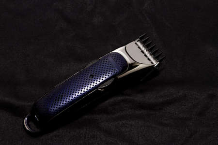 Machine for hair style barber shop.clipper haircut wirelessly on black background Machine for...