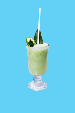 Mango smoothie in a tall glass. Drink in summer on a blue background.clipping maskの写真素材