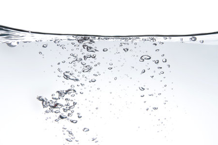 Beautiful water waves Water waves splashing in the clear white waterの写真素材