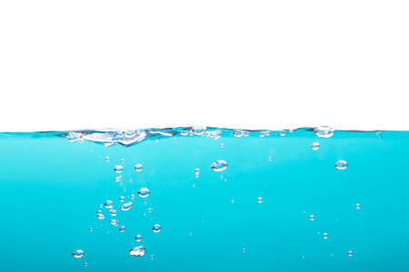 Bubbles floating in turquoise water on a white backgroundの写真素材