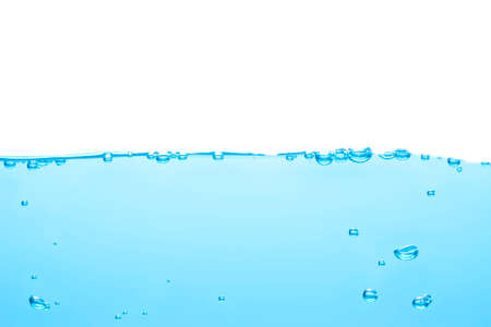 Bubbles float from the middle of the water rising to the water surface. Blue backgroundの写真素材