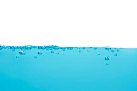 Bubbles float from the middle of the water rising to the water surface. Blue backgroundの写真素材