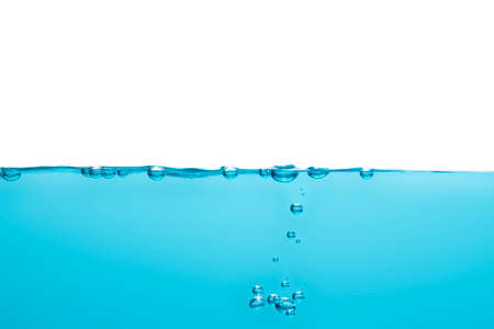 Bubbles float from the middle of the water rising to the water surface. Blue backgroundの写真素材