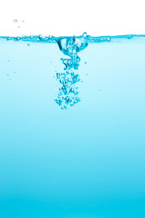 Many blurry bubbles Floating from the middle of the blue water To the surface with little waves Blue liquid backgroundの写真素材