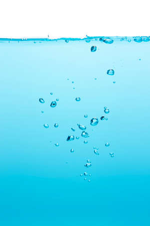 Many bubbles Floating from the middle of the blue water To the surface with little waves Blue liquid backgroundの写真素材