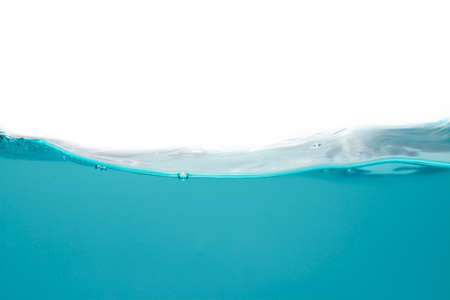 Water waves create bubbles and sludge dust in the blue water. against a white backgroundの写真素材