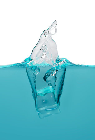 object falling into blue water until splashing on a gray background, freshness, nature, blurry objectsの写真素材