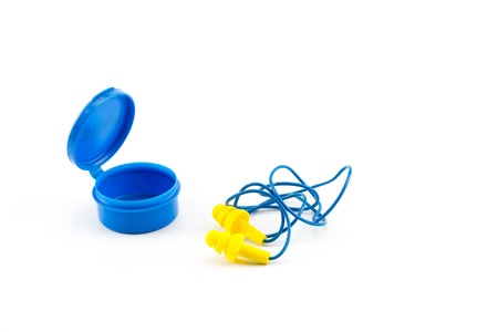 Yellow earplugs on a white backgroundの写真素材