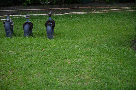 Water sprinklers on the lawn in the garden.の写真素材