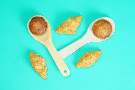Croissant bread and Banana cake pasted on an green background, candy layout patternsの写真素材