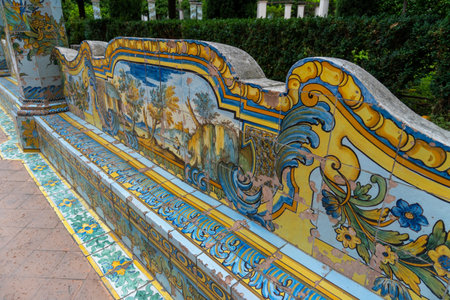 Interior of the cloister of Santa Chiara in Naples, with the pews lined with tiles on a cloudy day.のeditorial素材