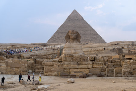 The sphinx with Khaphren's pyramid just behind in an afternoon with some clouds in the skyのeditorial素材