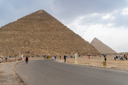 Image of the Giza Pyramid, with Khafre's Pyramid just behind it, from the road around them.